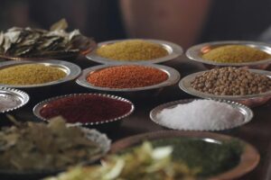 pexels-photo-36884865-36884865-4 Close-up of assorted spices and grains in metal bowls showcasing culinary variety.